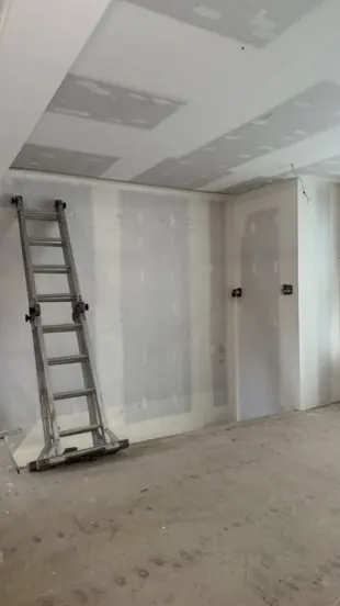 Commercial corridor drywalled and ready for paint