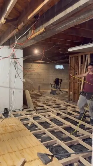 New subfloor built on joists during a full home renovation