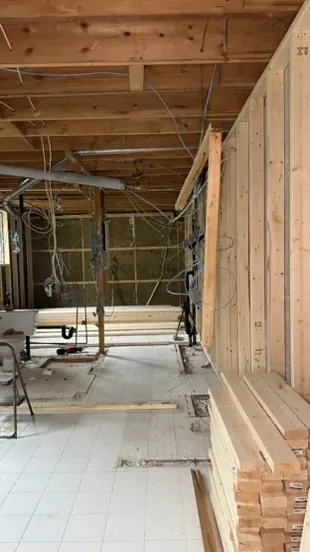 Structural beam installed to open up the living area of a Montreal home